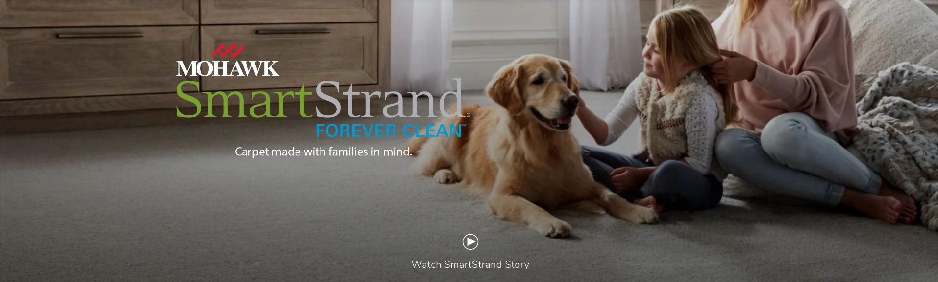 Mother and daughter sitting on SmartStrand carpet flooring with a golden retriever dog